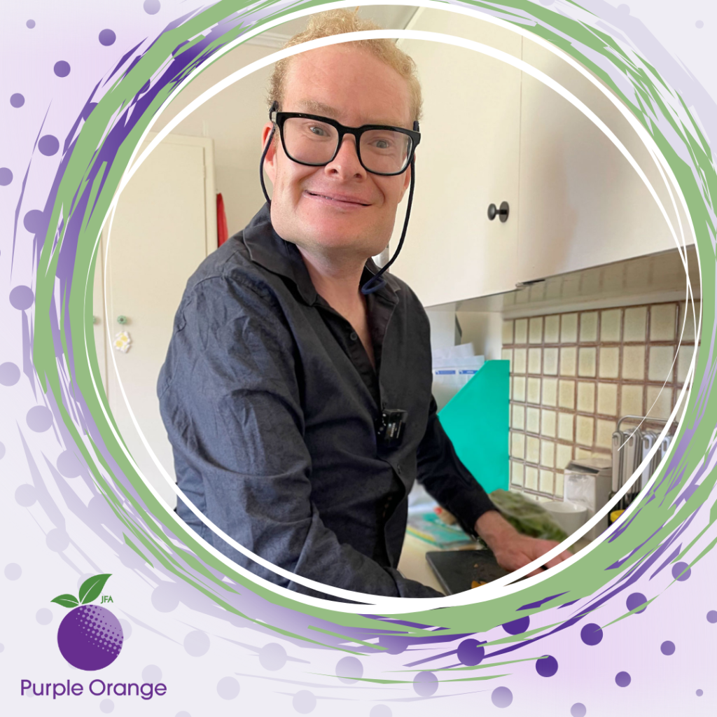 light purple background with dark purple spots. Swirling circles in dark purple, dusty purple, light green and white surround a photo of Tim, smiling while cutting vegetables